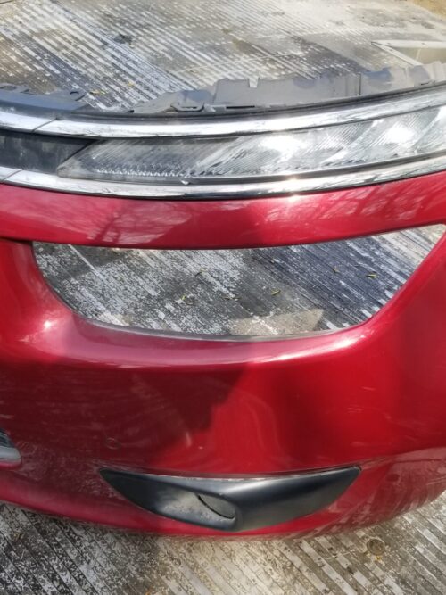 Red front bumper from Citroën C4 Grand Picasso, featuring integrated headlight and fog light housing, genuine used part.