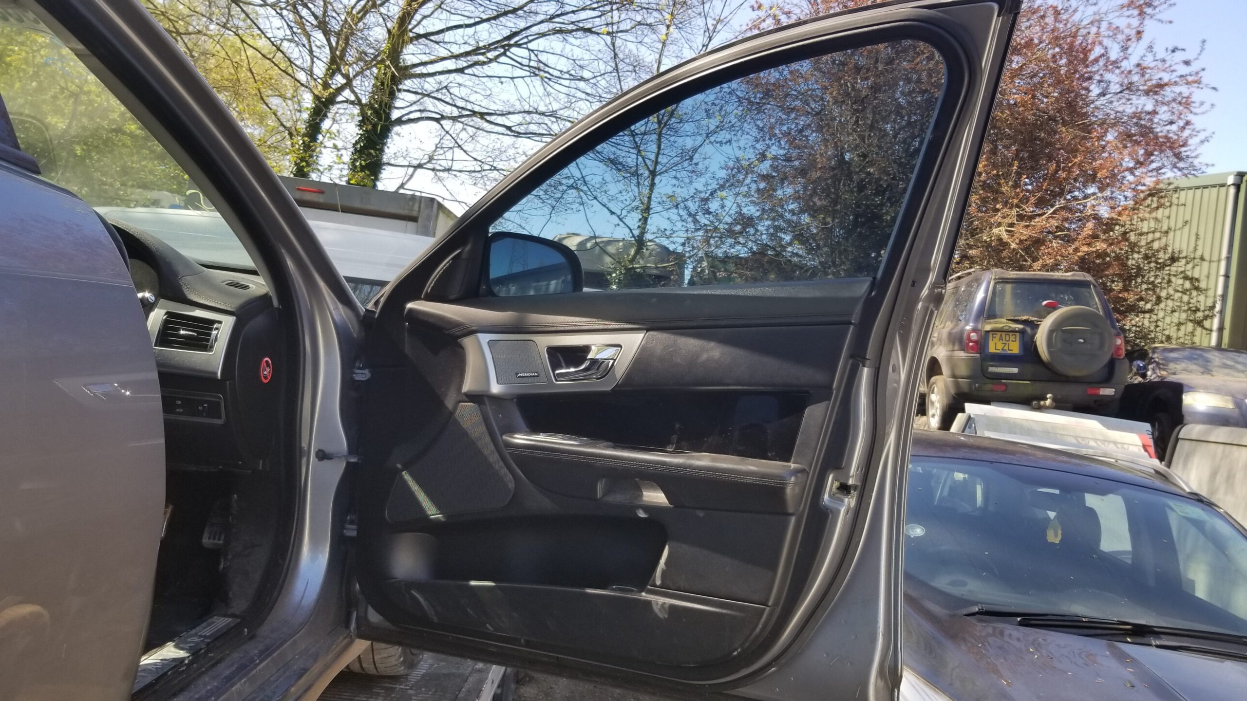 Interior view of driver side door for 2013 Jaguar XF