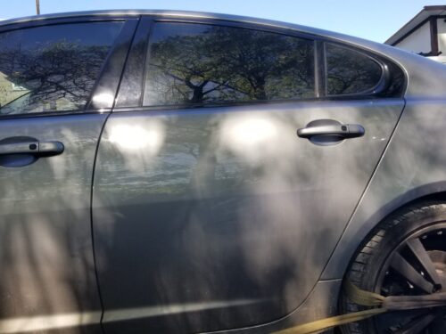 Exterior view of rear left passenger door from 2013 Jaguar XF S in grey
