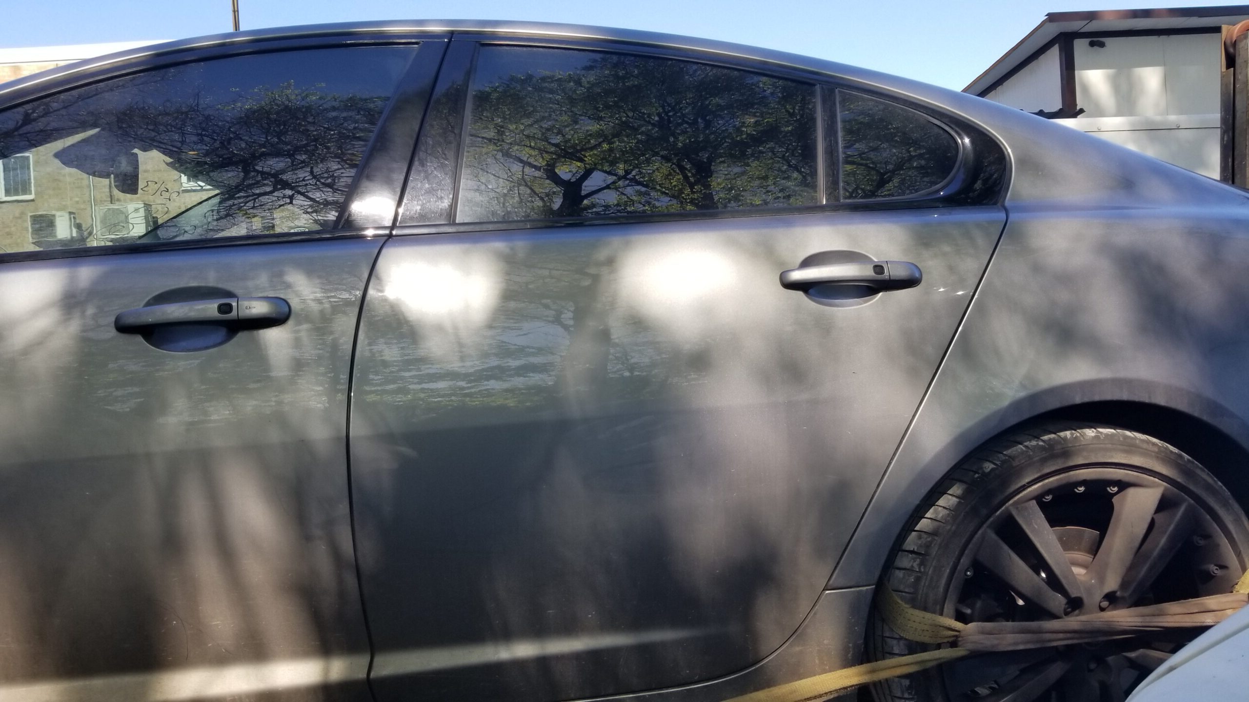 Exterior view of rear left passenger door from 2013 Jaguar XF S in grey