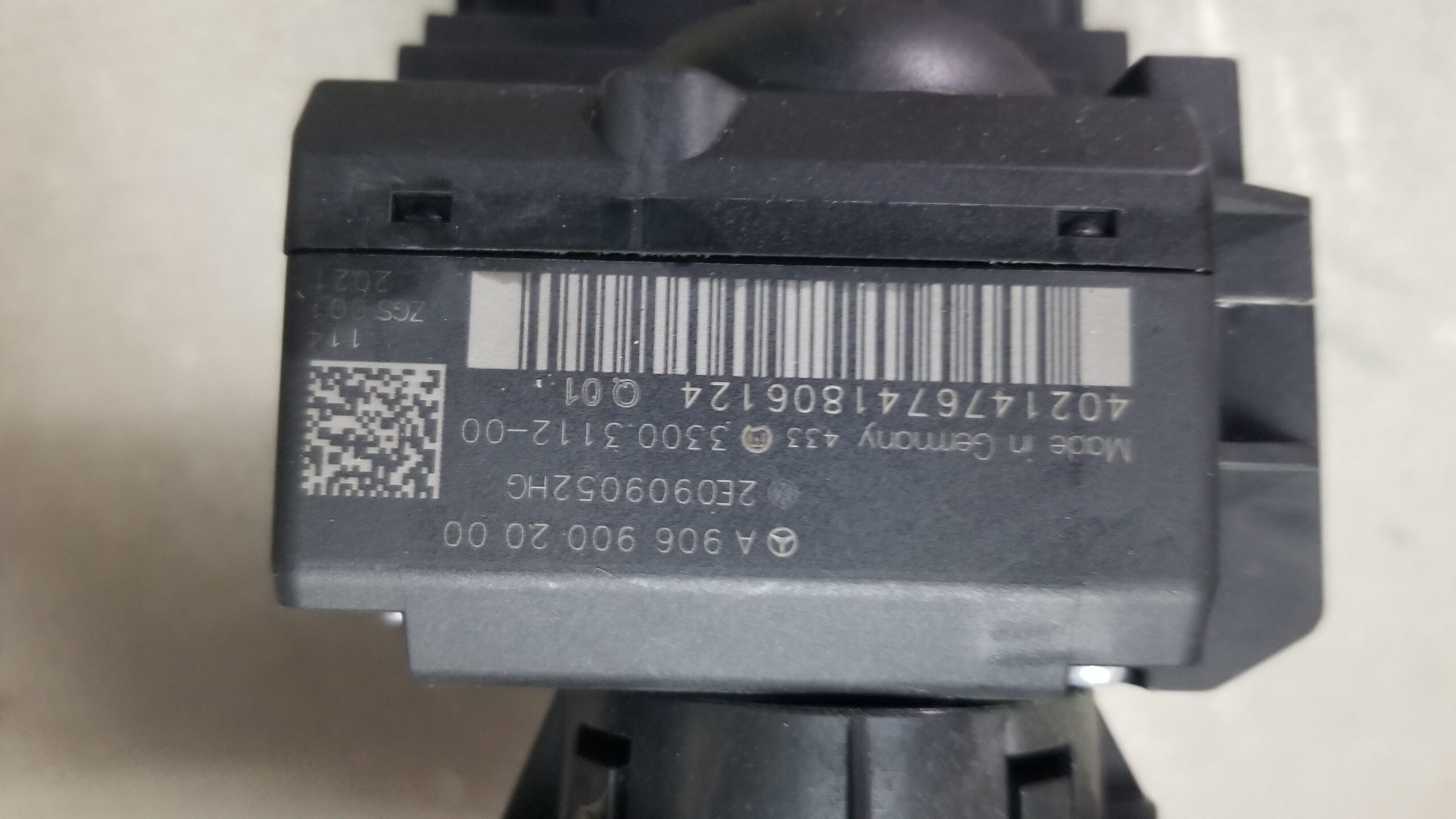 Close-up of VW Crafter 2012 ignition switch with part number A9069002000 and barcode