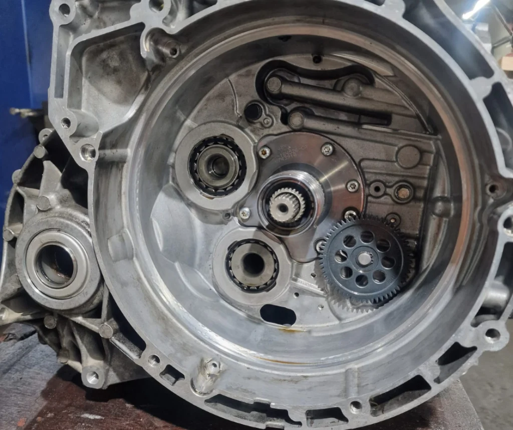 Close-up of a disassembled gearbox during repair service – suitable for manual and automatic transmission repairs