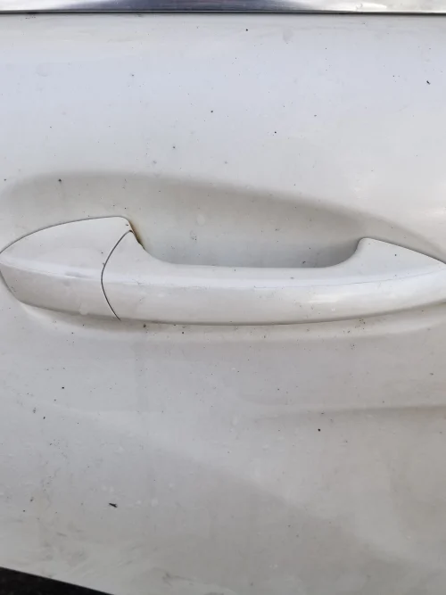 Close up of Mercedes CLS W218 rear driver side door handle white paint code 799 genuine used