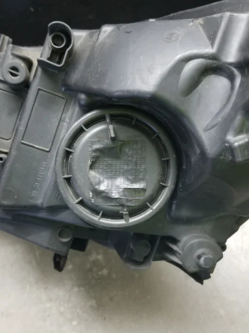 Vauxhall Astra J headlight rear bulb cover detail