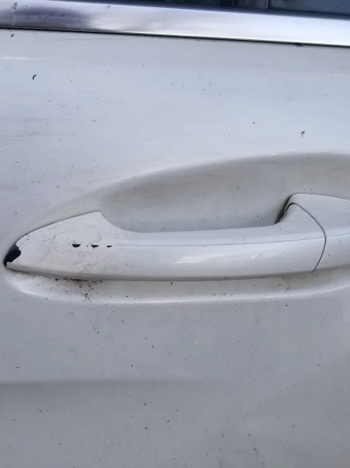 Close-up of Mercedes CLS W218 rear left door handle area white 799