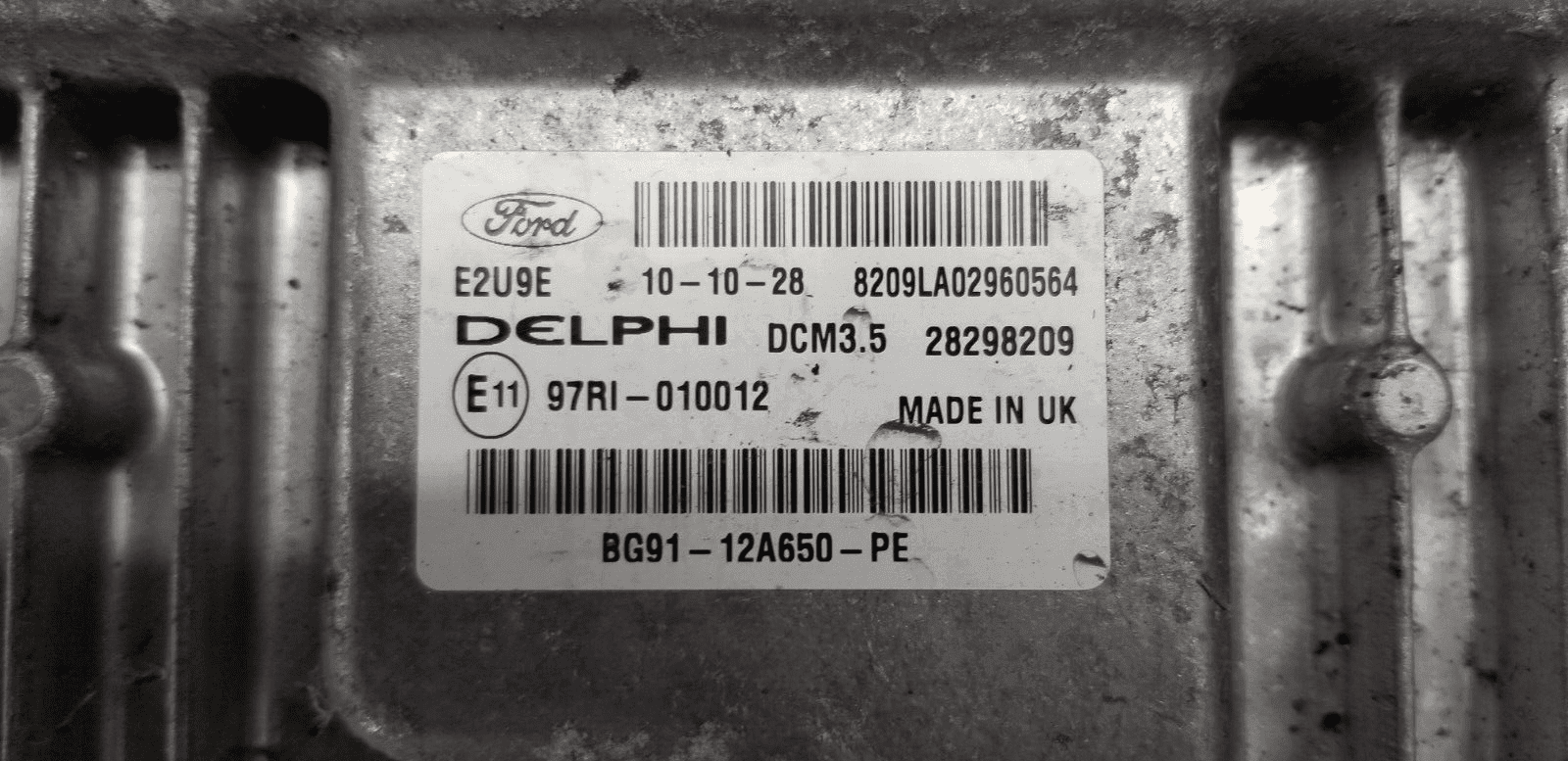 Label showing BG91‑12A650‑PE on control module