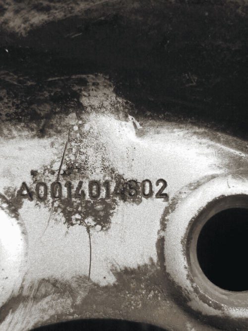 Close-up of part number A0014014802 on Sprinter wheel