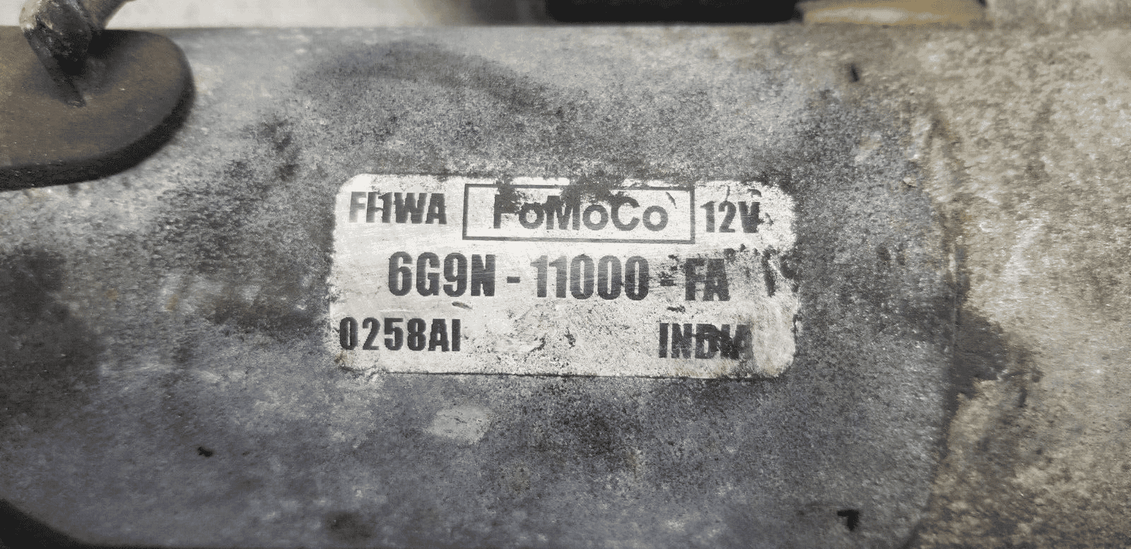 Close-up image of Ford Galaxy diesel starter motor with label visible