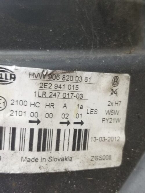 Label with part number HVW9068200361 on VW headlight