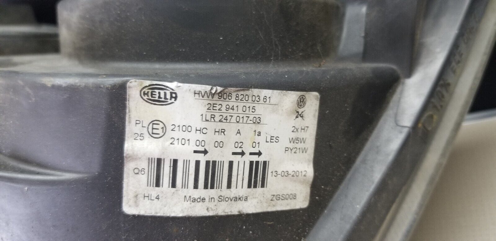 Label with part number HVW9068200361 on VW headlight