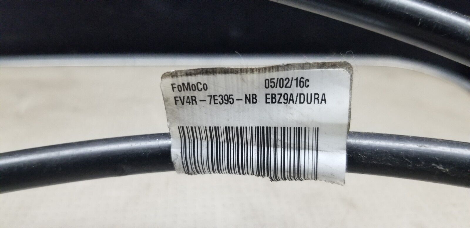 Close-up Ford Kuga gear shifter assembly FV4R-7E395-NB part number label