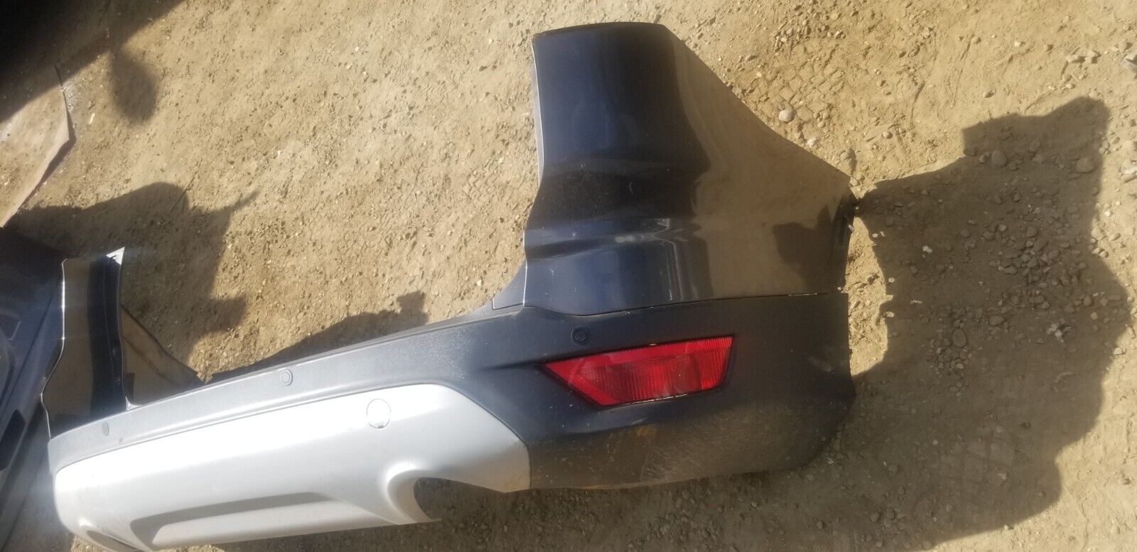 OEM part detail of Ford Kuga 2016 Magnetic Grey rear bumper assembly