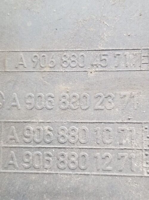 Close-up of part number A9068804571 on Mercedes Sprinter rear bumper