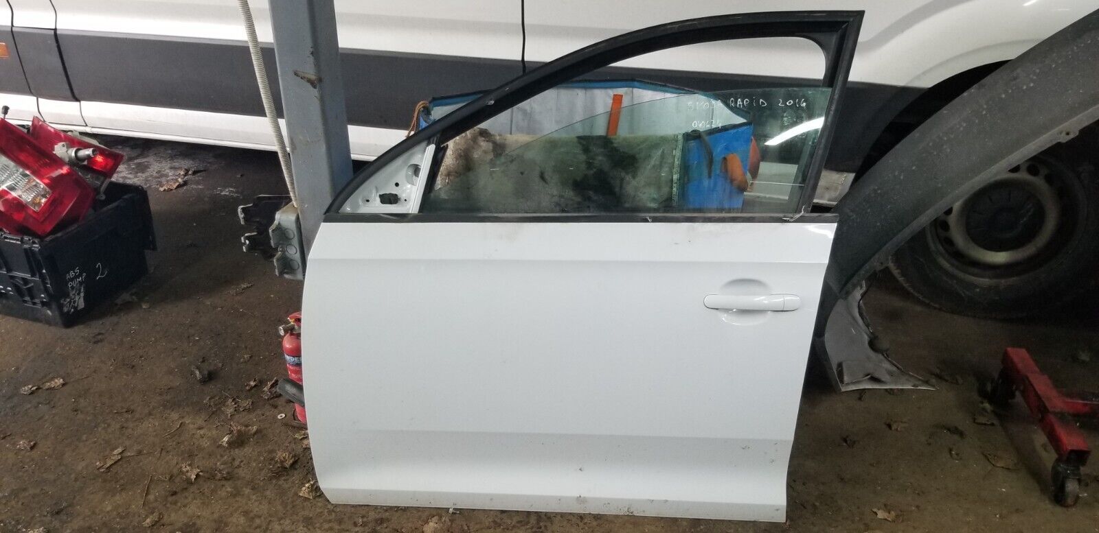 Skoda-Rapid-Front-Left-Door-White-2012-front