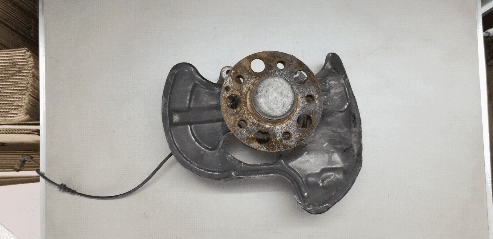 Close-up view of front left wheel hub from Mercedes E-Class W207