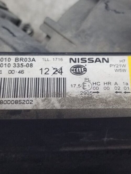 Label showing part number 26010BR03A on headlamp unit