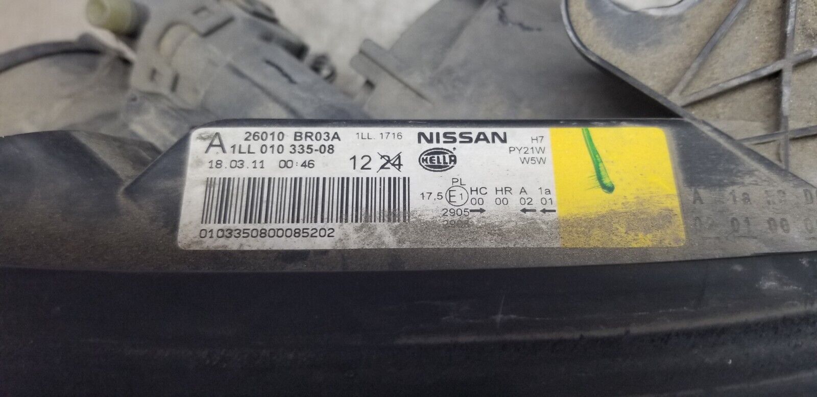 Label showing part number 26010BR03A on headlamp unit