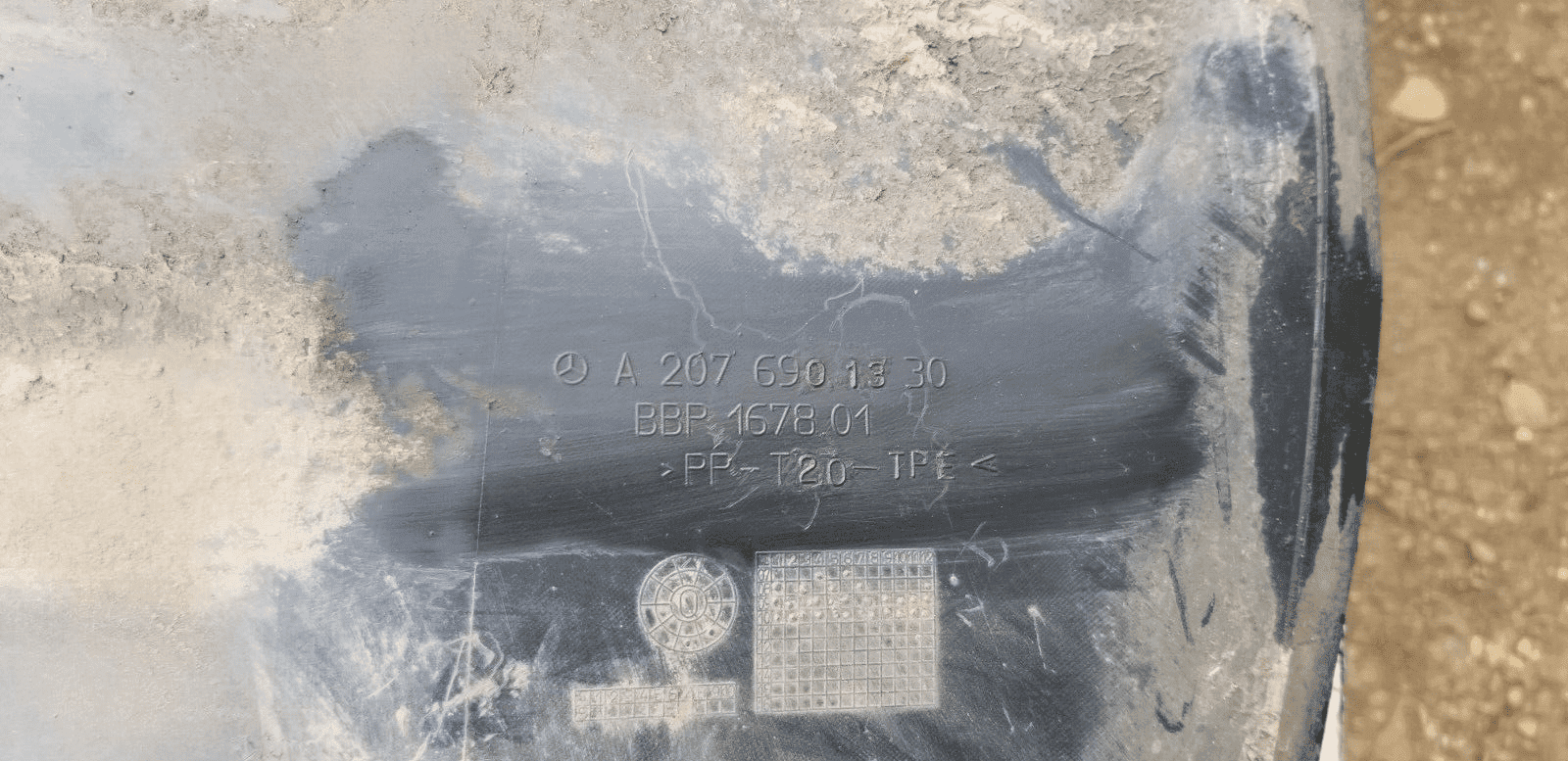 Wheel arch liner with part number A2076901330