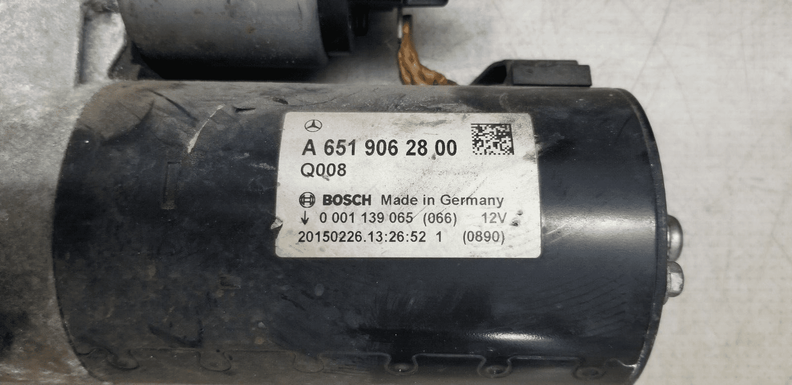 Close-up of Mercedes-Benz starter motor A6519062800 for 2.1 diesel