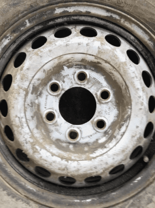 Close-up of 6x130 bolt pattern on steel wheel
