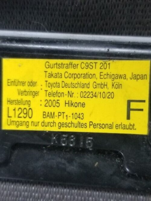 Close-up of TK-AF2-EF618-P info tag seat belt mechanism